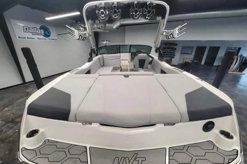 Slide: The Image of 2022 MasterCraft NXT24 boat interior at Dallas showroom, featuring sleek design and modern amenities. - 7