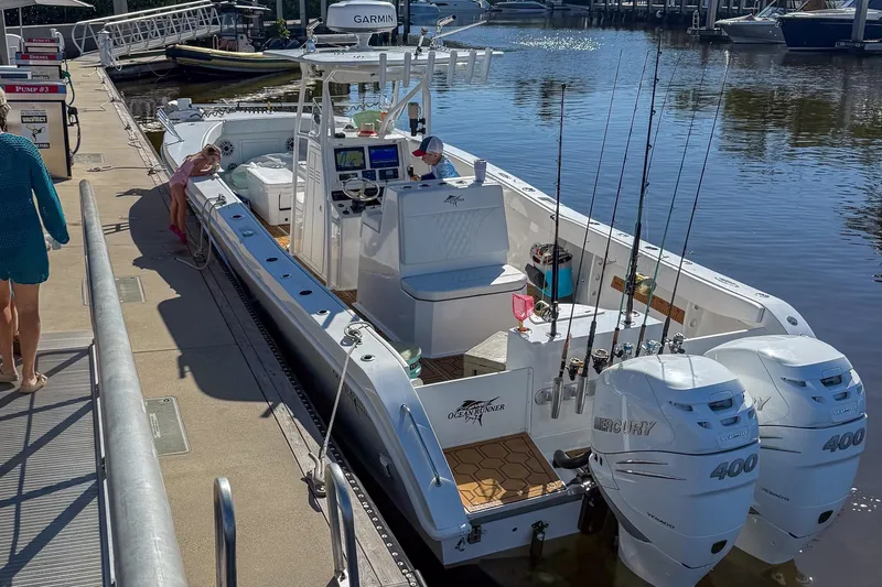 Slide: The Image of 2024 Ocean Runner 34 Center Console docked with dual Mercury 400 engines. - 10