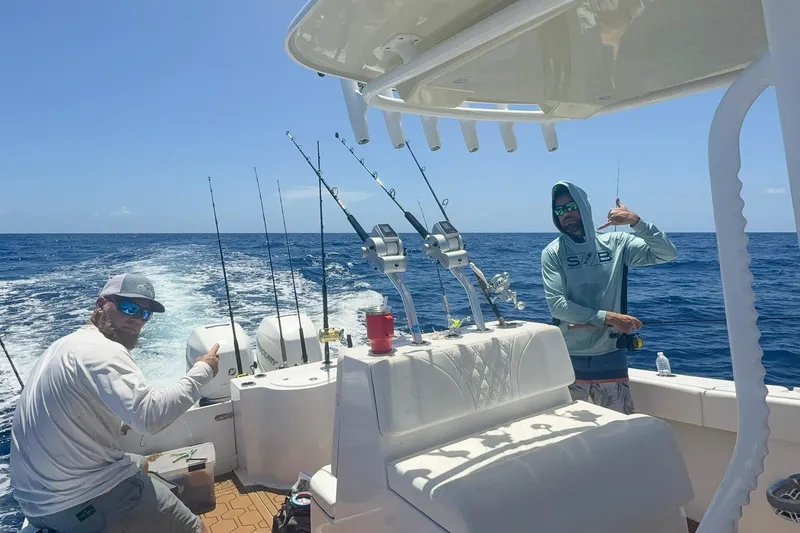Slide: The Image of Two people fishing on a 2024 Ocean Runner 34 Center Console boat. - 11