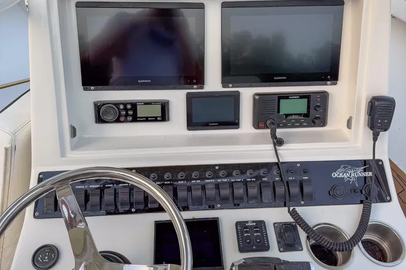 Slide: The Image of 2024 Ocean Runner 34 Center Console dashboard with Garmin displays and controls. - 6