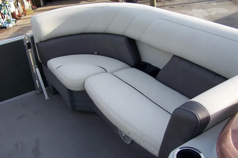 Slide: The Image of 2023 Sylvan Mirage 8520 Party Fish boat seating, featuring plush gray upholstery. - 10