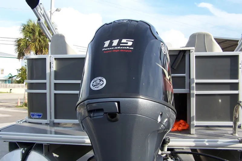 Slide: The Image of 2023 Sylvan Mirage 8520 Party Fish with Yamaha 115 outboard motor, docked outdoors. - 13