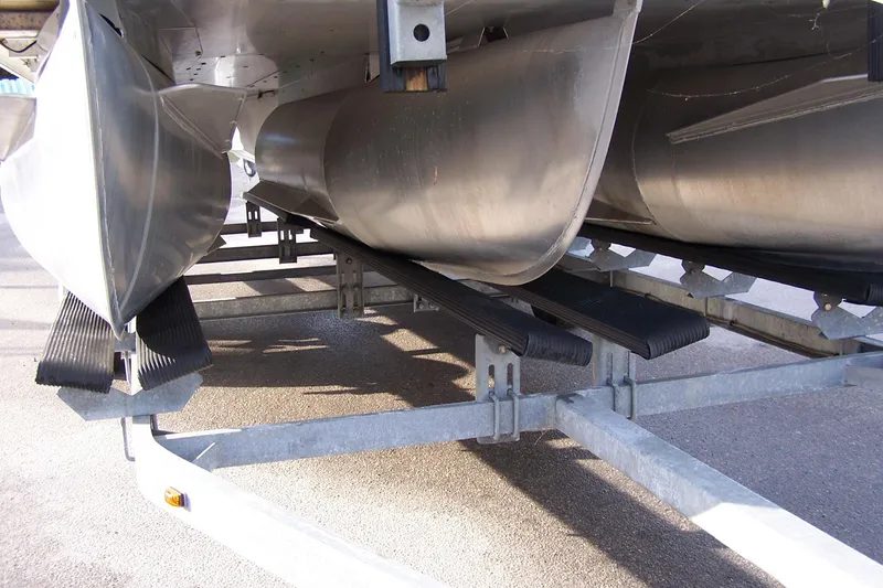 Slide: The Image of 2023 Sylvan Mirage 8520 Party Fish pontoon boat on trailer, underside view. - 2