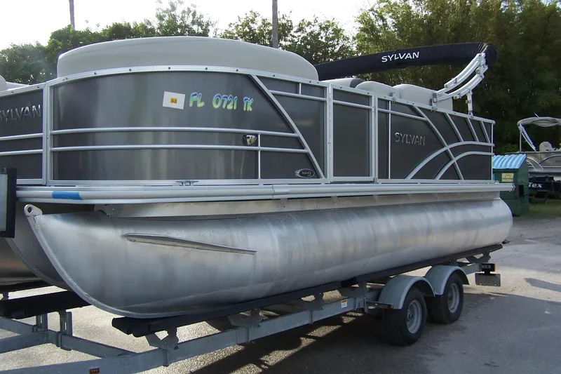 Slide: The Image of 2023 Sylvan Mirage 8520 Party Fish pontoon boat on trailer, side view. - 3