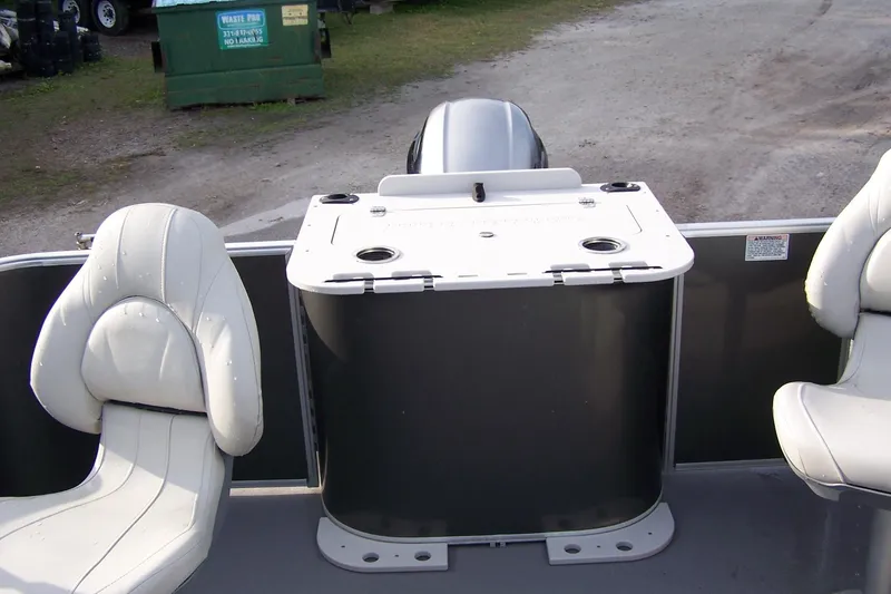 Slide: The Image of 2023 Sylvan Mirage 8520 Party Fish boat interior with seating and storage. - 5