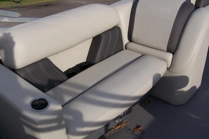 Slide: The Image of 2023 Sylvan Mirage 8520 Party Fish boat seating with cup holder, featuring elegant upholstery. - 6