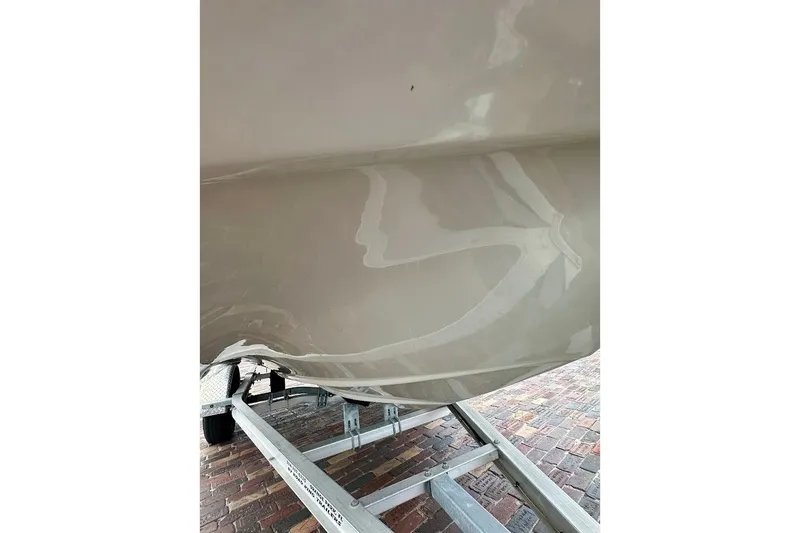 Slide: The Image of 2023 Starcraft SVX 171 OB boat hull on a trailer, showcasing sleek design. - 10