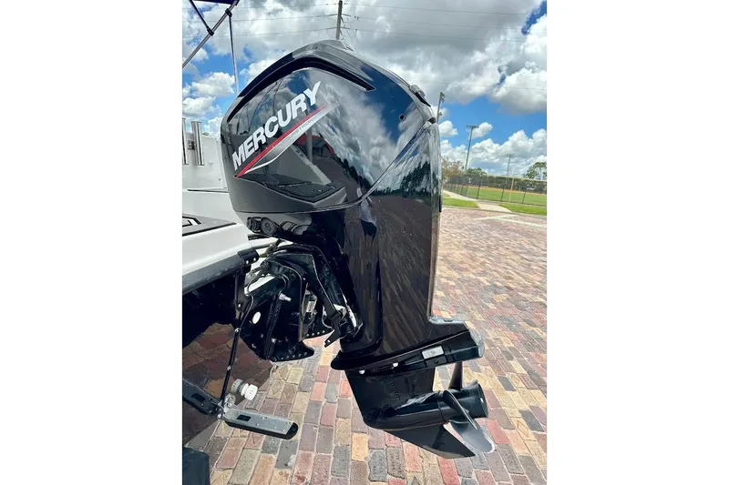 Slide: The Image of Mercury outboard motor on 2023 Starcraft SVX 171 OB boat, parked on brick pavement. - 17