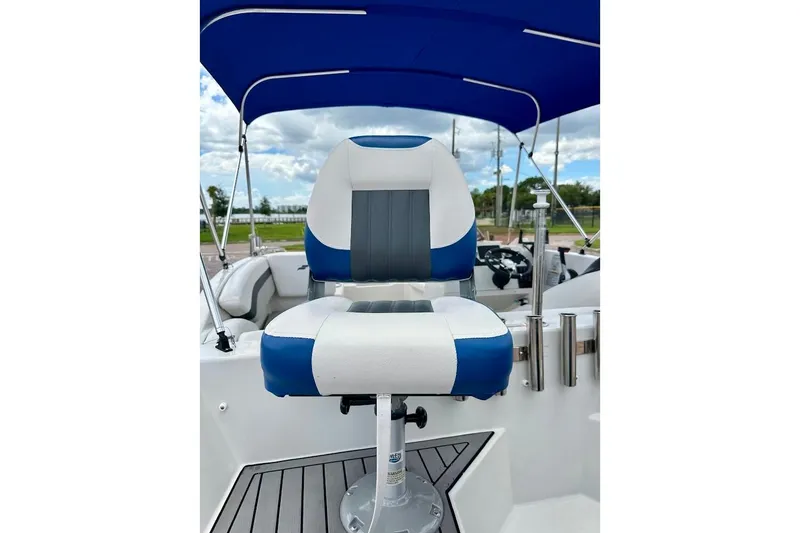 Slide: The Image of 2023 Starcraft SVX 171 OB boat seat with blue canopy and sleek design. - 21