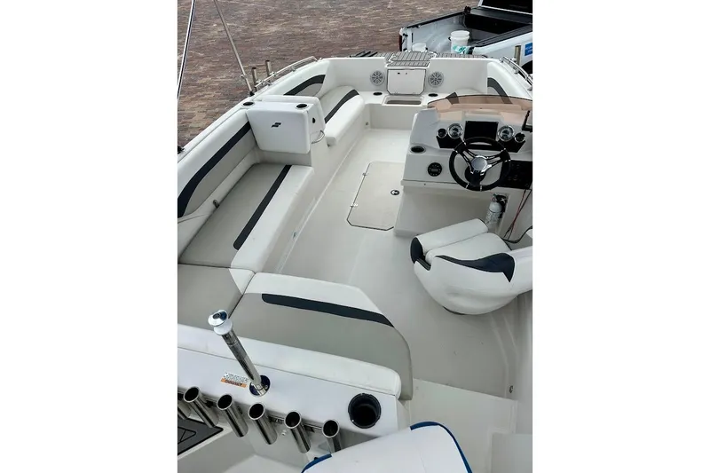 Slide: The Image of 2023 Starcraft SVX 171 OB boat interior with seating and steering console. - 24