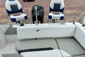 Slide: The Image of 2023 Starcraft SVX 171 OB boat interior with seating and motor. - 25