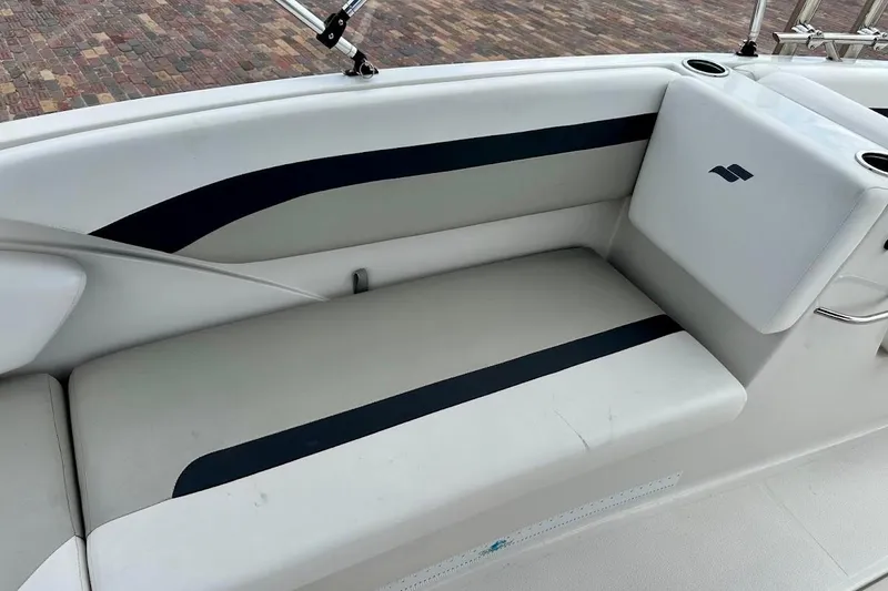 Slide: The Image of 2023 Starcraft SVX 171 OB boat interior seating with cup holders and sleek design. - 26