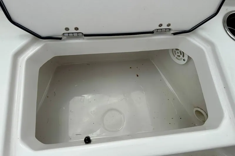 Slide: The Image of Open storage compartment in 2023 Starcraft SVX 171 OB boat. - 28