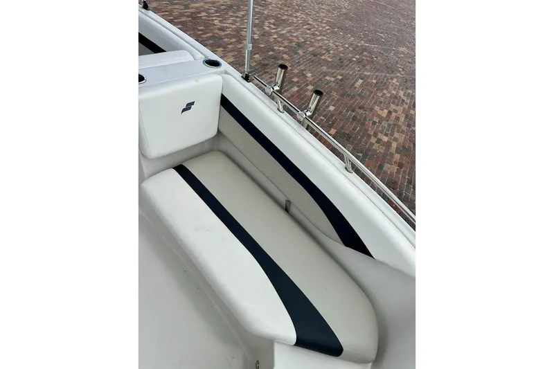 Slide: The Image of 2023 Starcraft SVX 171 OB boat interior with cushioned seating and rod holders. - 29