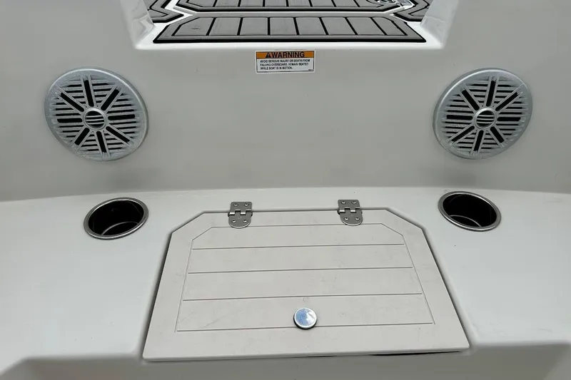 Slide: The Image of 2023 Starcraft SVX 171 OB boat interior with speakers and storage compartment. - 32