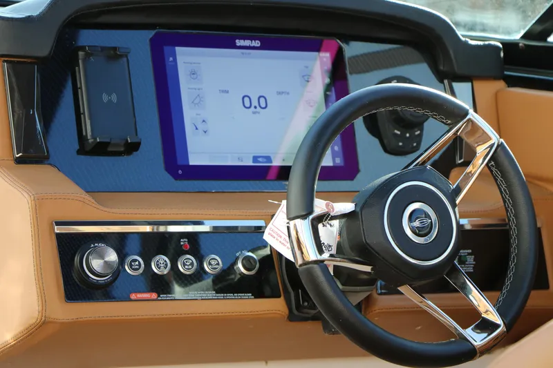Slide: The Image of 2025 Chaparral 2870 SSX dashboard with steering wheel and digital display. - 23