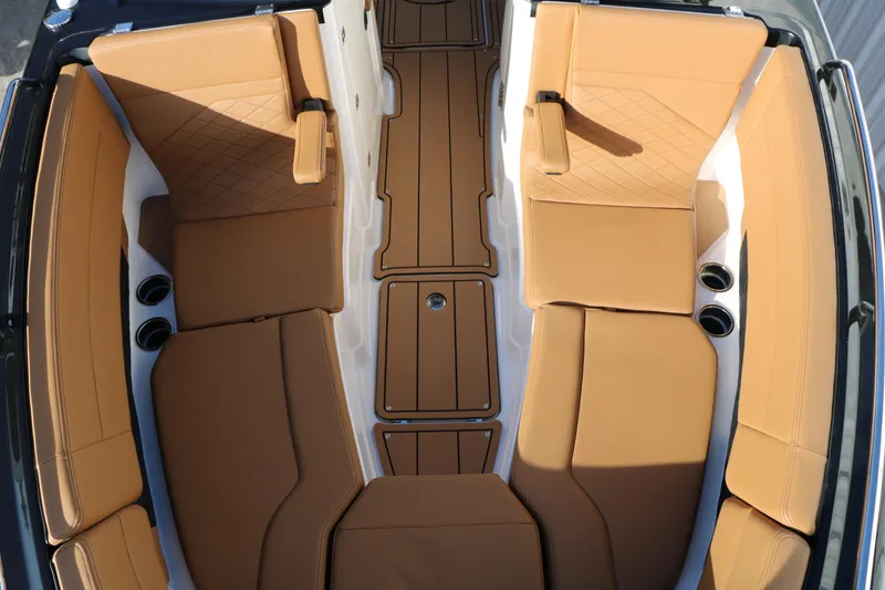 Slide: The Image of 2025 Chaparral 2870 SSX boat interior with tan leather seating and sleek design. - 27