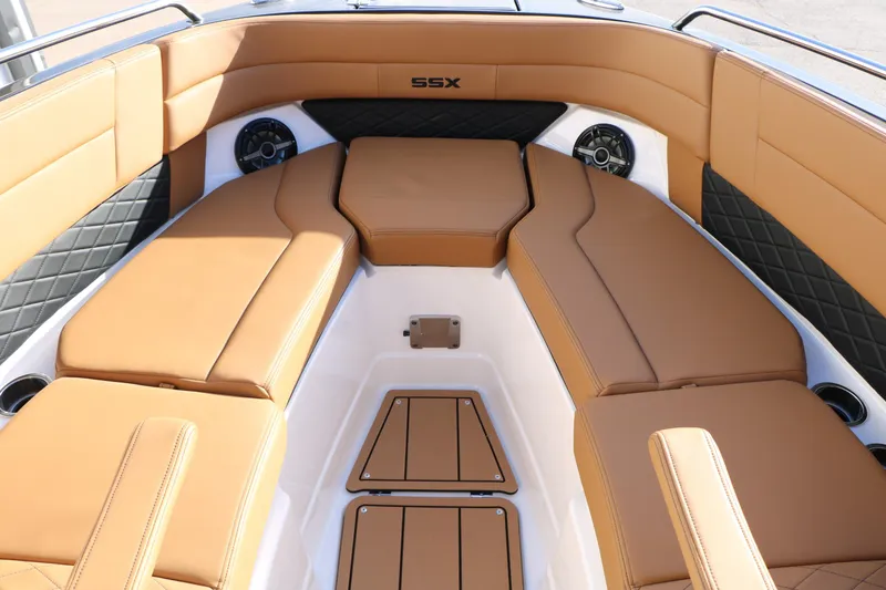 Slide: The Image of 2025 Chaparral 2870 SSX boat interior with tan leather seating and modern design. - 29