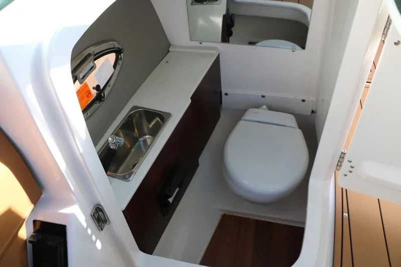Slide: The Image of 2025 Chaparral 2870 SSX boat bathroom with sink and toilet. - 36