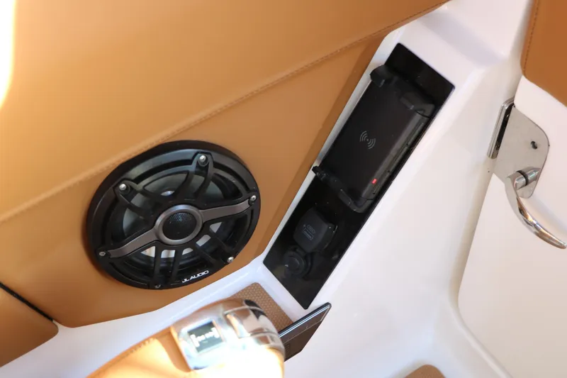 Slide: The Image of 2025 Chaparral 2870 SSX interior with speaker and phone charging dock. - 38