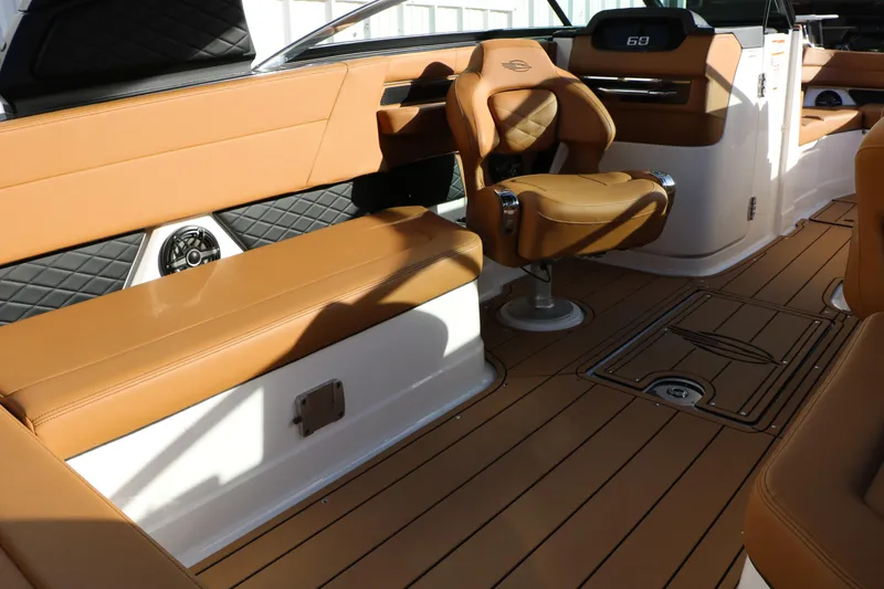 Slide: The Image of 2025 Chaparral 2870 SSX boat interior with tan leather seating and modern design. - 39