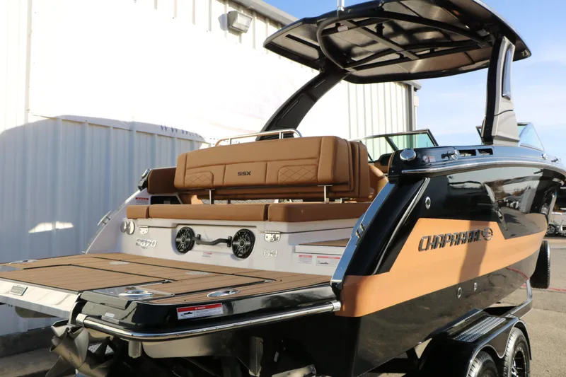 Slide: The Image of 2025 Chaparral 2870 SSX boat with sleek design and luxurious seating. - 4