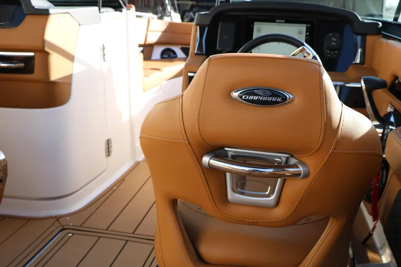 Slide: The Image of Luxurious interior of 2025 Chaparral 2870 SSX boat with tan leather seating. - 40