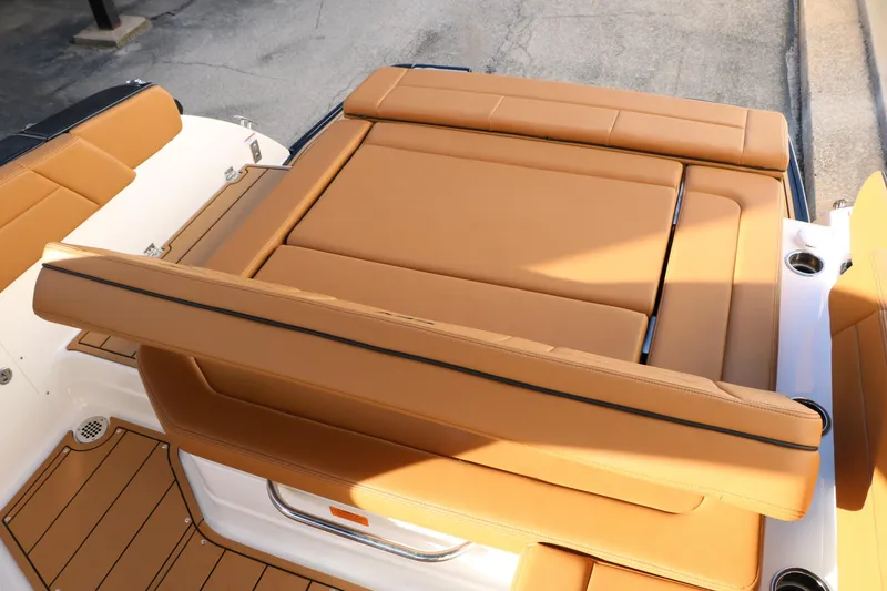 Slide: The Image of 2025 Chaparral 2870 SSX boat with tan leather seating and sleek design. - 43
