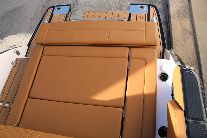 Slide: The Image of 2025 Chaparral 2870 SSX boat with tan leather seating and sleek design. - 44