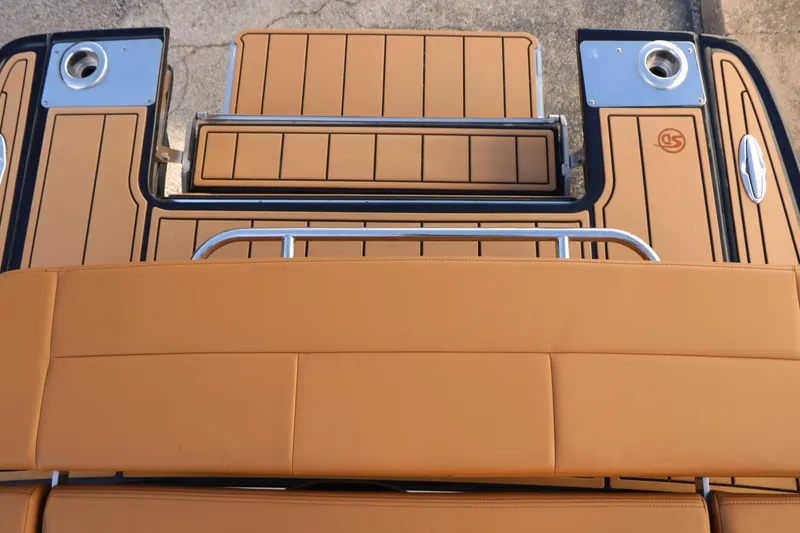 Slide: The Image of 2025 Chaparral 2870 SSX boat deck with tan upholstery and stainless steel accents. - 45