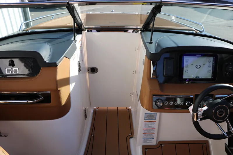 Slide: The Image of 2025 Chaparral 2870 SSX boat interior with modern dashboard and controls. - 46