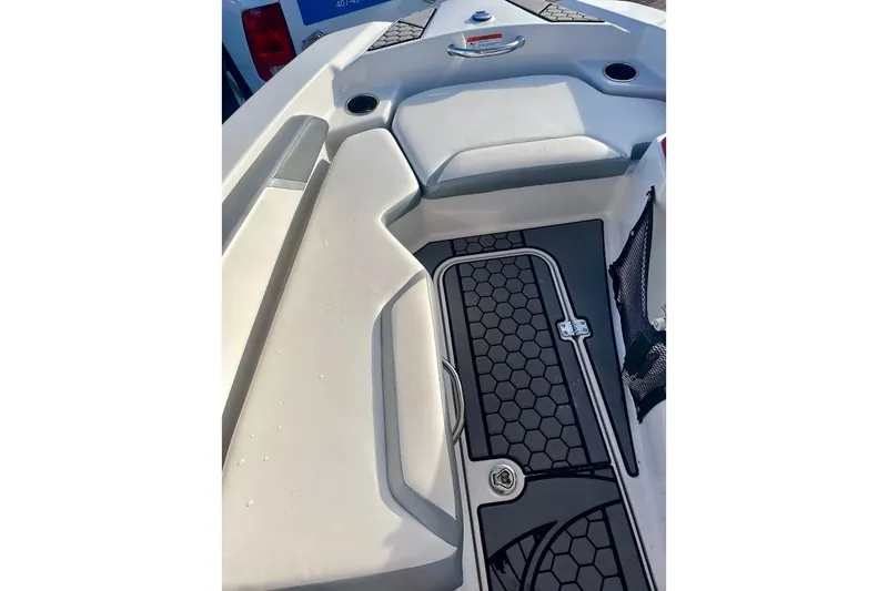 Slide: The Image of Interior of 2017 Scarab 165 HO boat with hexagonal floor pattern and seating. - 14