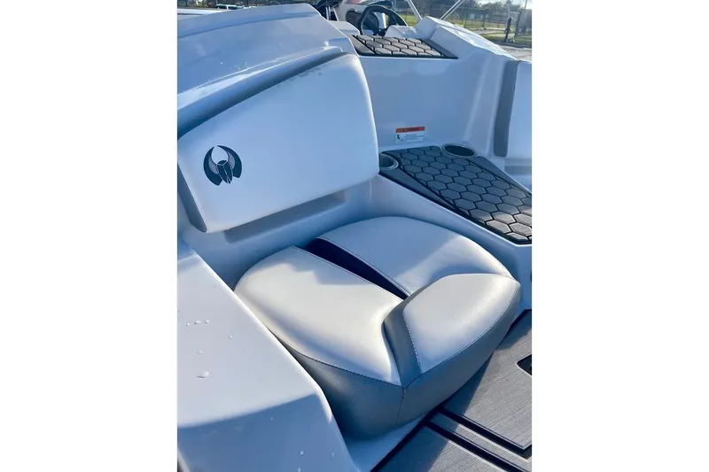 Slide: The Image of 2017 Scarab 165 HO boat interior with cushioned seating and hexagonal-patterned flooring. - 16