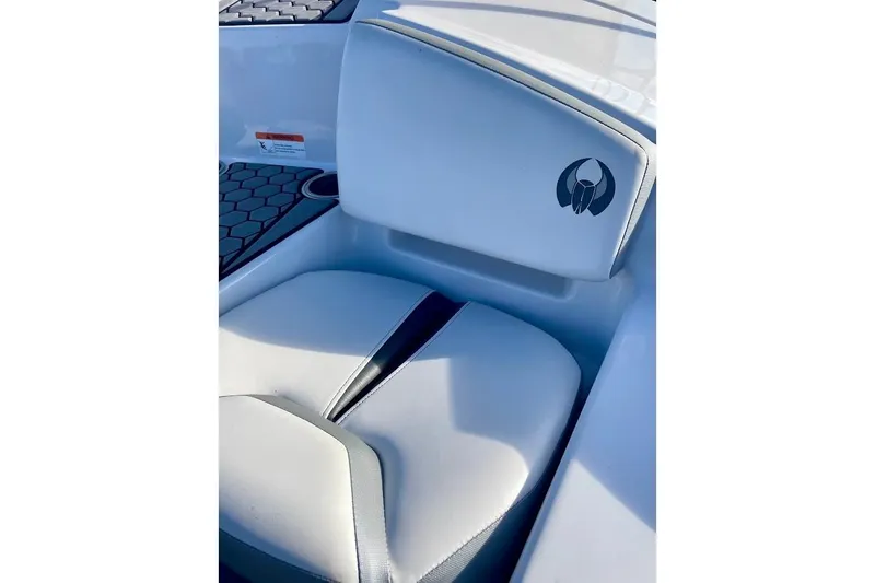 Slide: The Image of 2017 Scarab 165 HO boat seat with logo, featuring sleek white upholstery. - 17