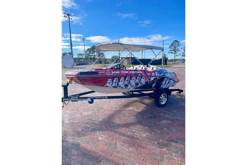 Slide: The Image of 2017 Scarab 165 HO boat with Star Wars-themed graphics on a trailer. - 4