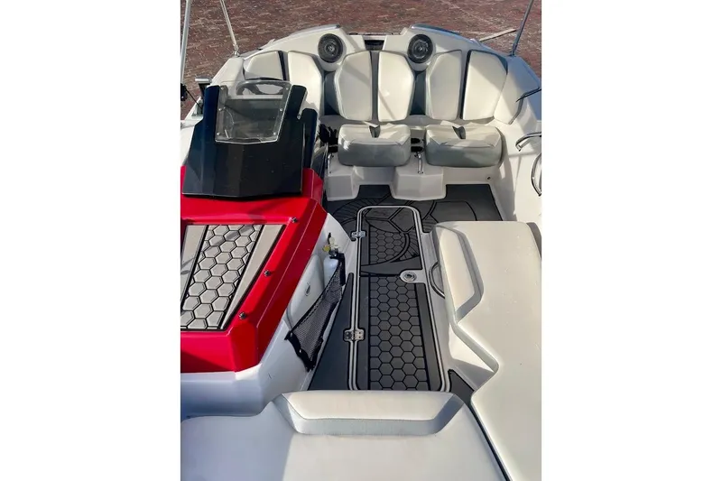 Slide: The Image of 2017 Scarab 165 HO boat interior with red accents and seating. - 6