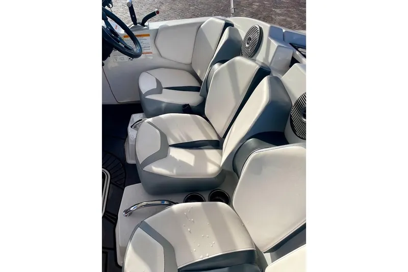 Slide: The Image of 2017 Scarab 165 HO boat interior with sleek white and gray seating. - 9