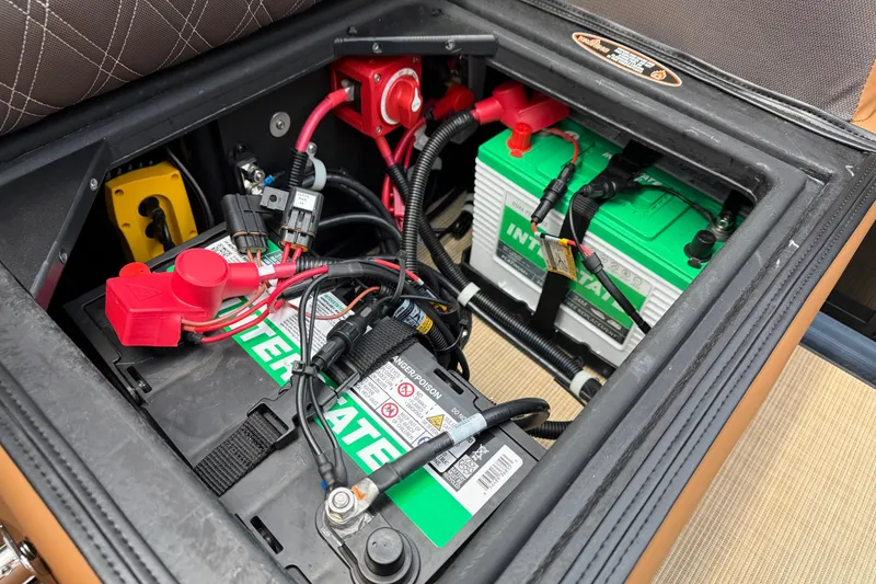 Slide: The Image of Battery compartment of 2026 Harris Cruiser 230 with Interstate batteries and wiring. - 11