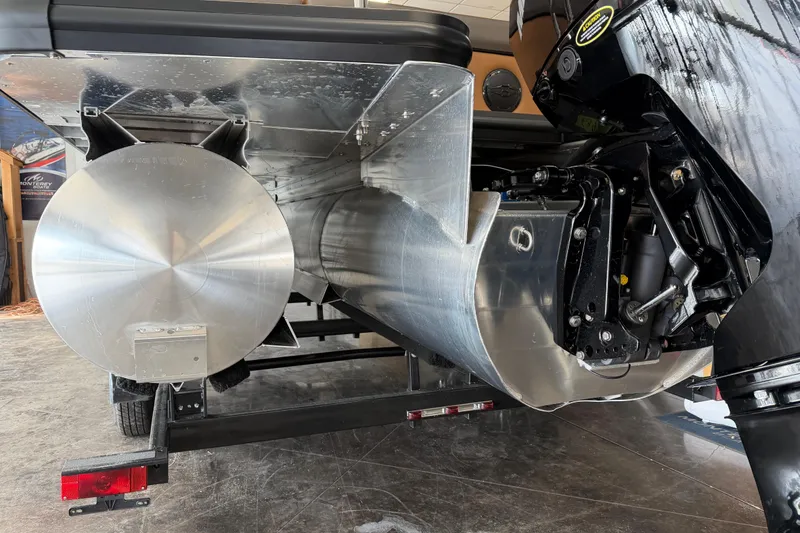 Slide: The Image of 2026 Harris Cruiser 230 pontoon boat with visible engine and aluminum structure. - 4