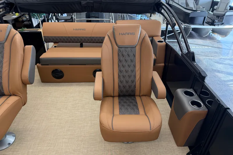 Slide: The Image of Luxurious interior of 2026 Harris Cruiser 230 boat with tan leather seating. - 7