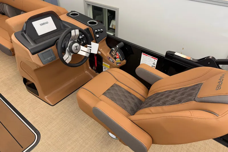 Slide: The Image of Luxurious interior of 2026 Harris Cruiser 230 boat with tan leather seating and modern dashboard. - 8