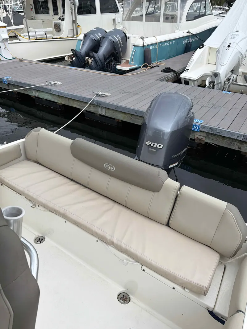 Slide: The Image of Key West 219 FS boat 2023 at dock with outboard motor. - 10