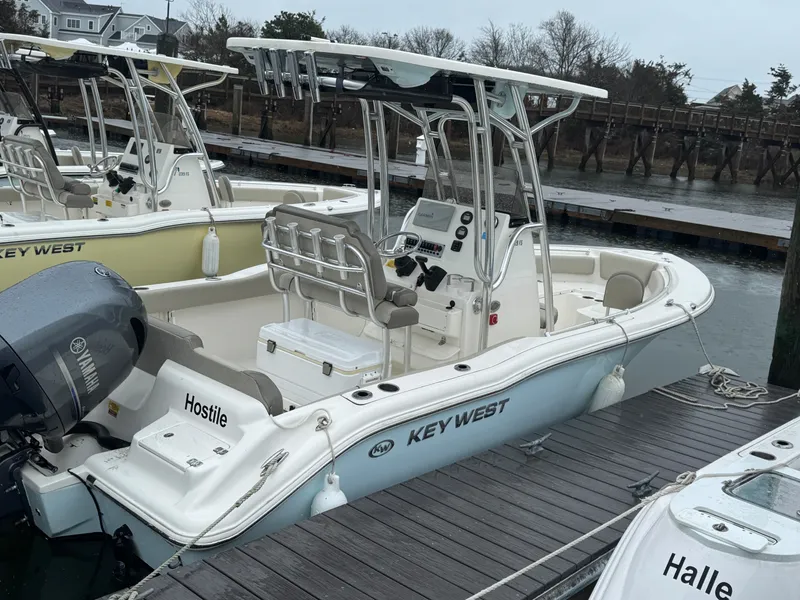 Slide: The Image of 2023 Key West 219 FS boat docked at marina. - 4