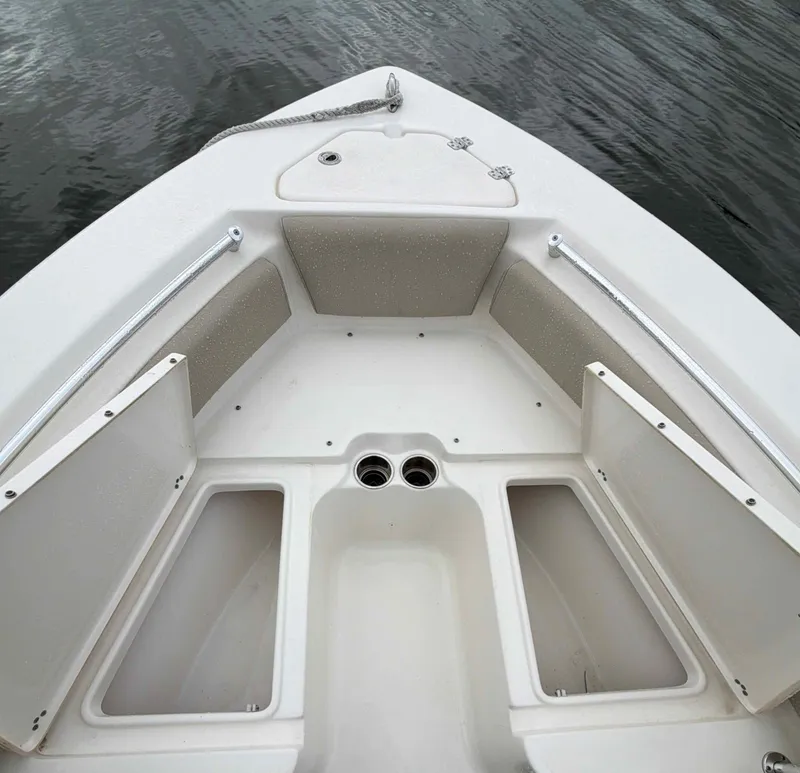 Slide: The Image of Key West 219 FS 2023 boat bow with storage compartments. - 7