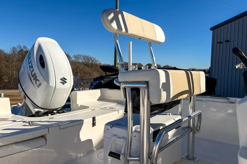 Slide: The Image of 2026 Bulls Bay 2200 XS boat with Suzuki outboard motor and cushioned seating. - 5