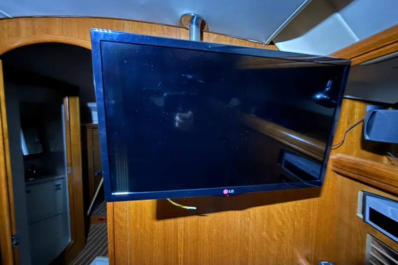 Slide: The Image of Flat-screen TV mounted inside a 2005 Hunter 46LE yacht cabin. - 14