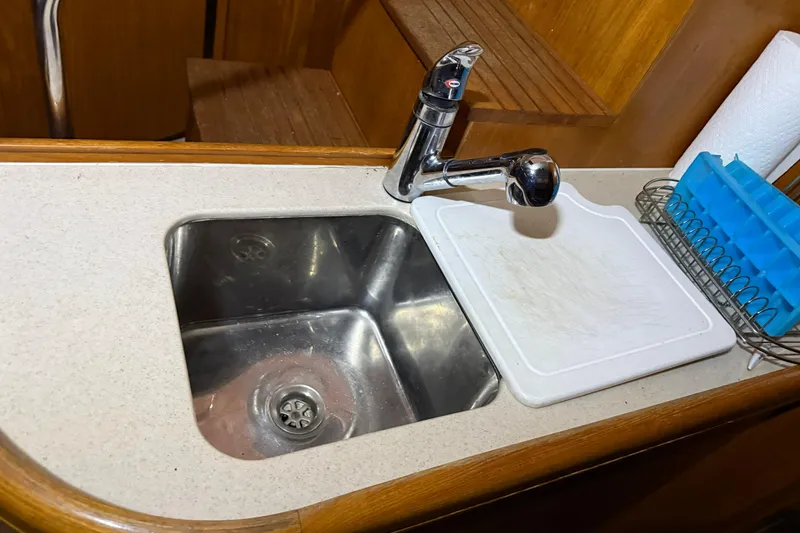 Slide: The Image of Stainless steel sink and faucet in 2005 Hunter 46LE yacht kitchen. - 17