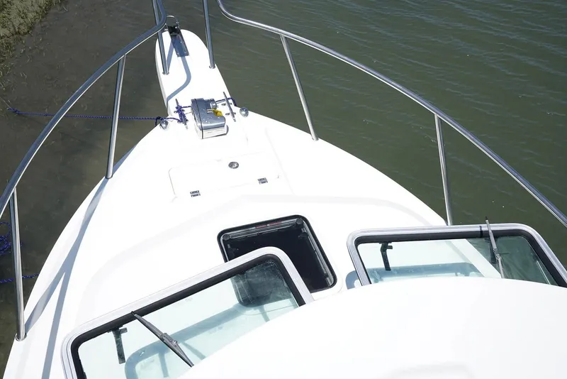 Slide: The Image of Manufacturer Provided Image: 2019 Parker 2320 Sport Cabin boat bow view on water. - 15