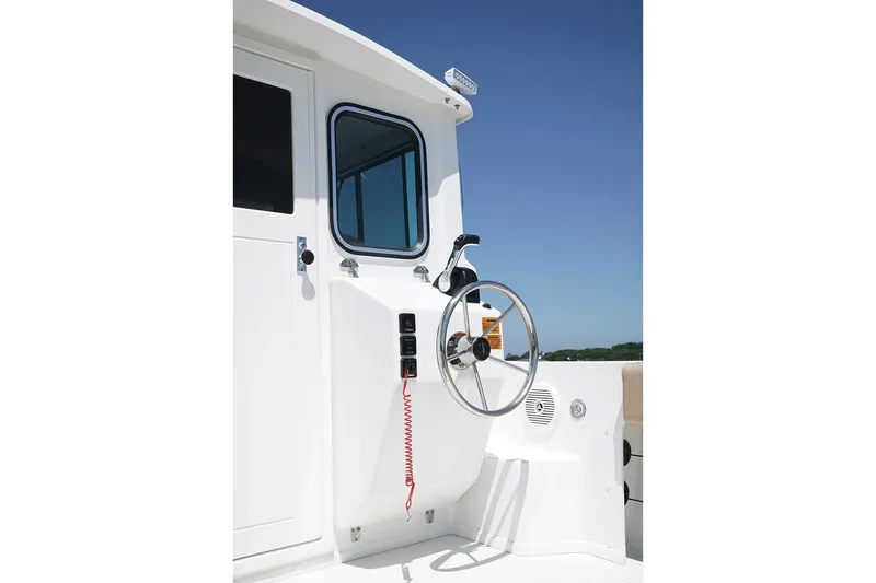 Slide: The Image of Manufacturer Provided Image: 2019 Parker 2320 Sport Cabin boat helm station with steering wheel and controls. - 22