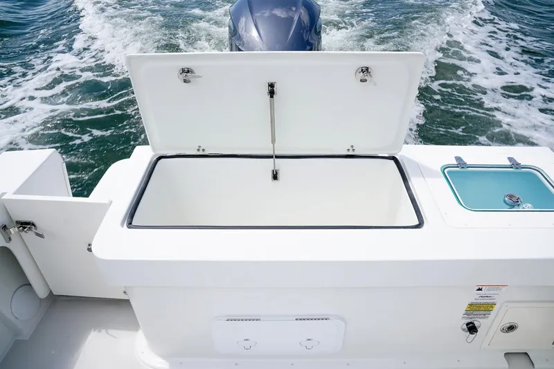 Slide: The Image of Manufacturer Provided Image: Open storage compartment on a 2019 Parker 2320 Sport Cabin boat. - 25